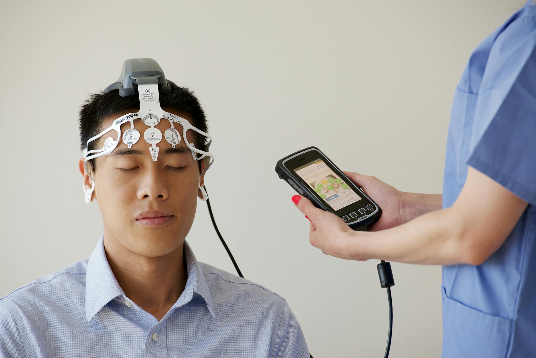 man during examination with use of brainscope
